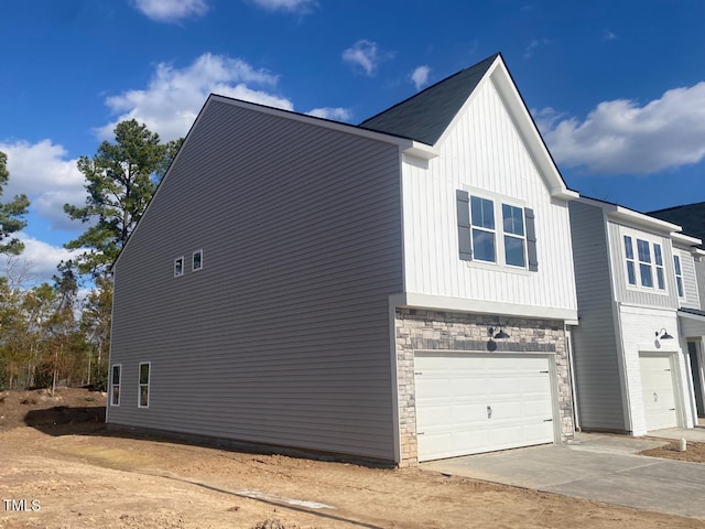 view of side of property featuring a garage