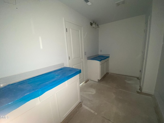 bathroom with concrete flooring