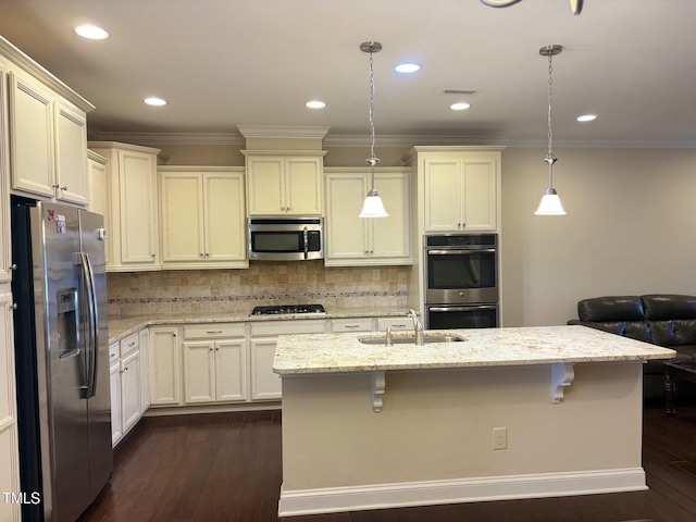 kitchen with appliances with stainless steel finishes, dark hardwood / wood-style flooring, backsplash, and decorative light fixtures