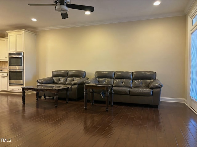 living room featuring ceiling fan, dark hardwood / wood-style floors, and crown molding