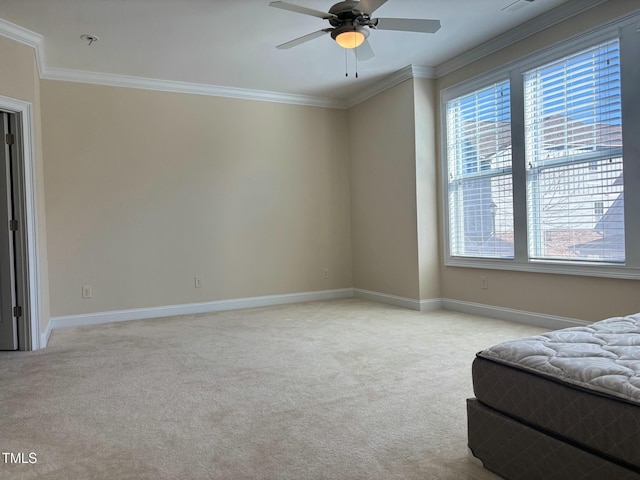 carpeted bedroom with ceiling fan and ornamental molding