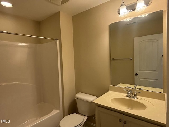 full bathroom featuring toilet, bathing tub / shower combination, and vanity