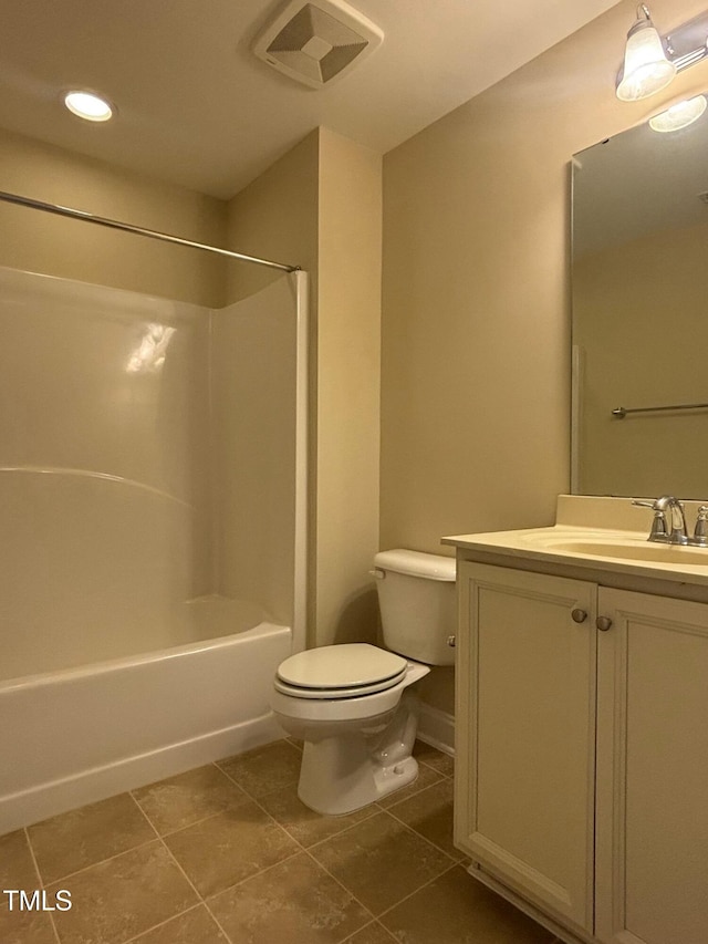 full bathroom with toilet, vanity, tile patterned flooring, and shower / washtub combination