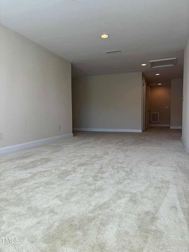 unfurnished room with light colored carpet