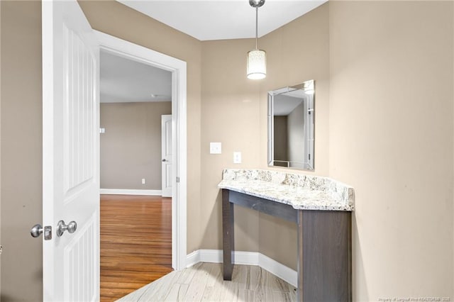 bathroom with hardwood / wood-style flooring and vanity