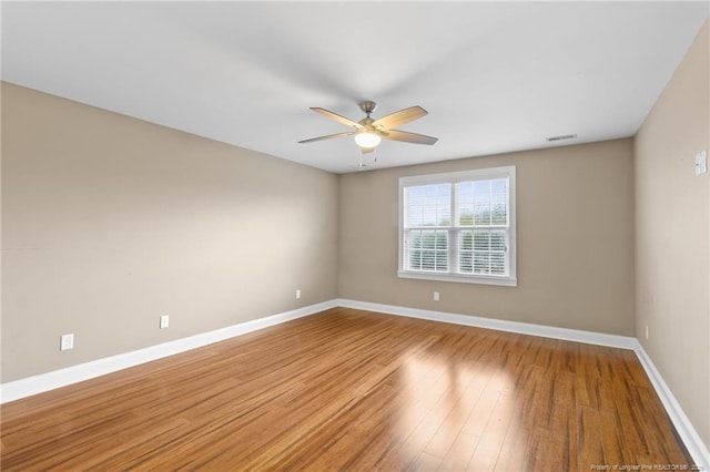 spare room with ceiling fan and light hardwood / wood-style floors