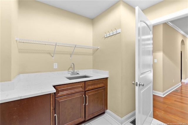 washroom with sink and light wood-type flooring