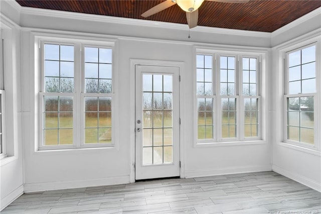 doorway with wood ceiling, a wealth of natural light, ornamental molding, and ceiling fan