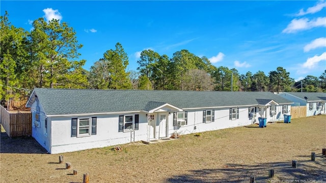 ranch-style house with a front lawn