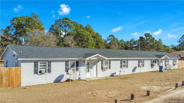 ranch-style home with a front lawn