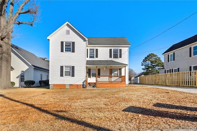 front of property featuring a porch and a front yard