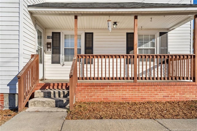 doorway to property with covered porch