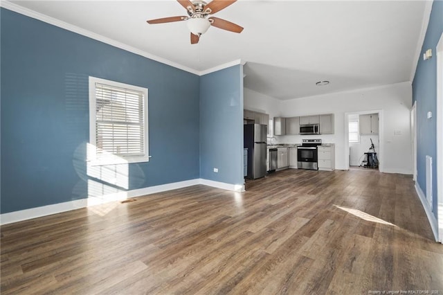 unfurnished living room with ceiling fan, wood-type flooring, and crown molding