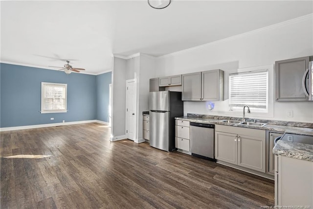 kitchen with ceiling fan, stainless steel appliances, gray cabinets, and sink