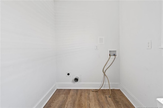 washroom with hardwood / wood-style flooring, hookup for a washing machine, and hookup for an electric dryer