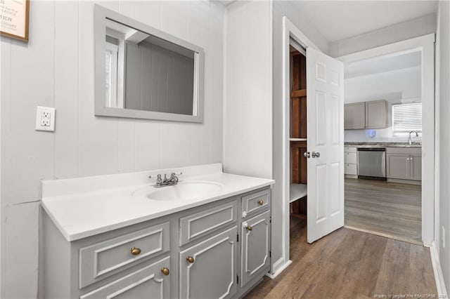 bathroom featuring hardwood / wood-style flooring and vanity