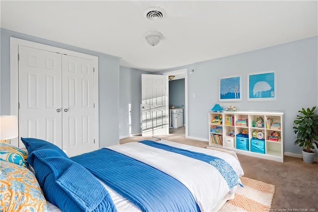 bedroom featuring a closet and carpet flooring