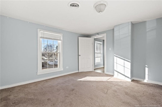 view of carpeted spare room