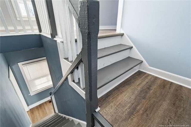 stairway featuring hardwood / wood-style flooring