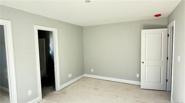 unfurnished bedroom with baseboards