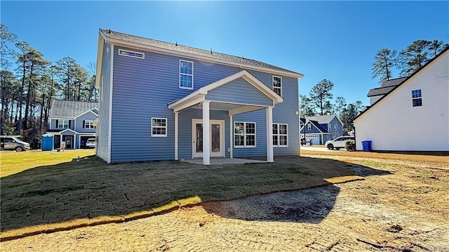 back of house with a patio, french doors, and a yard