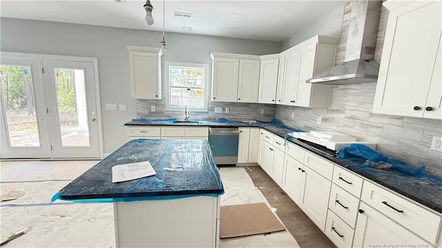 425 Shawcroft Rd, Fayetteville, NC 28311 - kitchen with wall chimney range hood, stainless steel dishwasher, visible vents, and white cabinetry