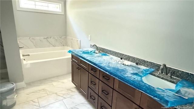 425 Shawcroft Rd, Fayetteville, NC 28311 - bathroom featuring a sink, a bath, marble finish floor, and toilet