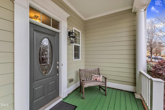 entrance to property featuring covered porch