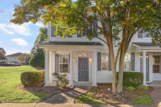 property entrance with a yard