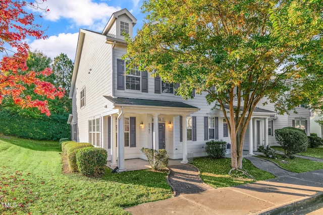 view of front of home with a front lawn