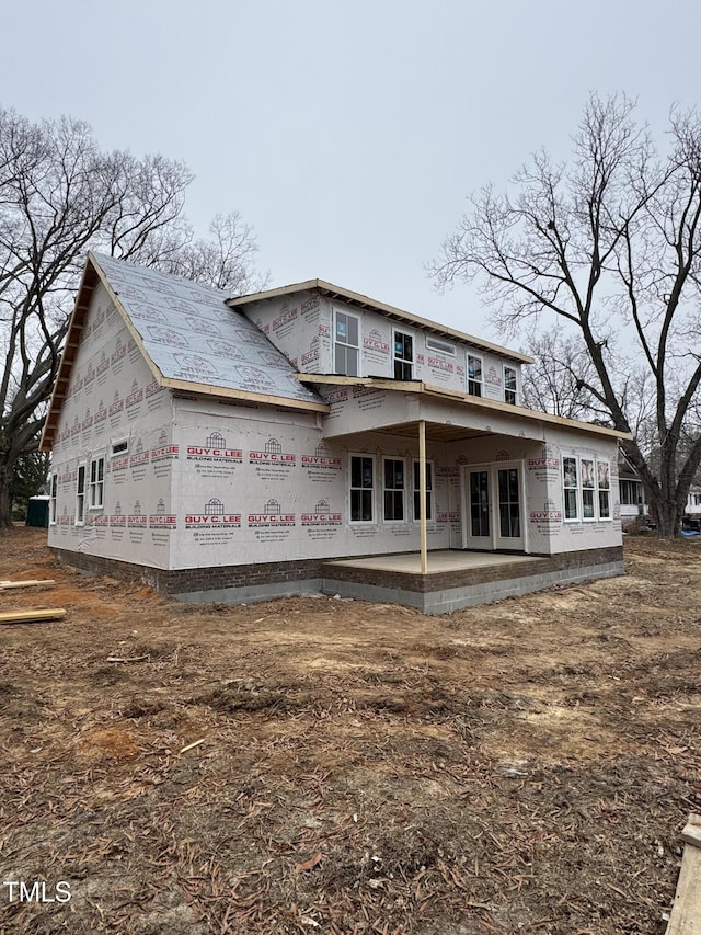 back of property with a patio