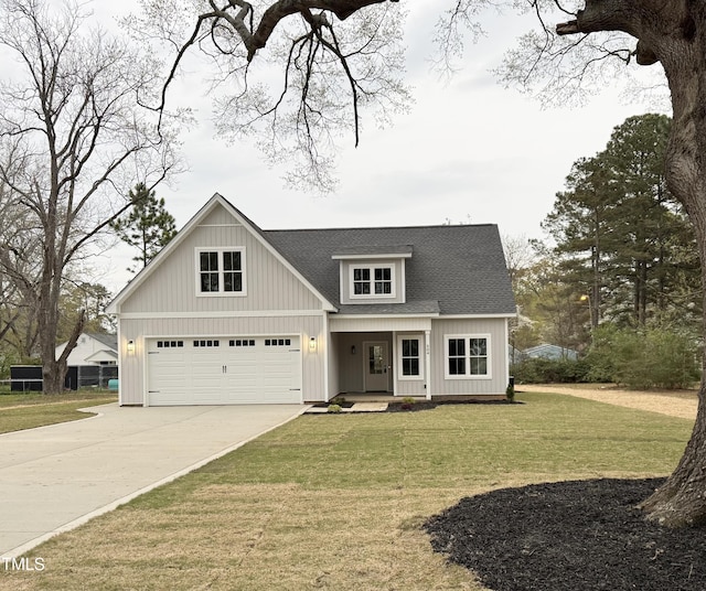 504 Tucker St, Four Oaks, NC 27524 - modern farmhouse style home featuring an attached garage, concrete driveway, a front lawn, roof with shingles, and a porch