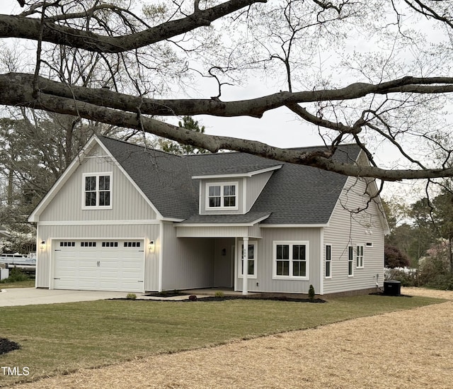 504 Tucker St, Four Oaks, NC 27524 - modern inspired farmhouse with driveway, a shingled roof, a front yard, and an attached garage