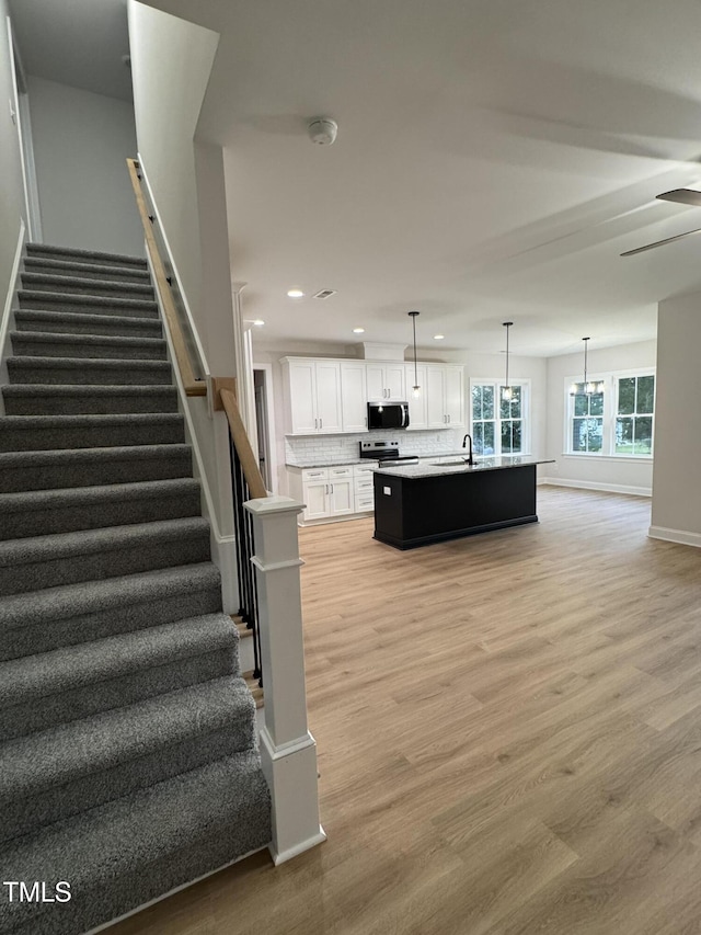 504 Tucker St, Four Oaks, NC 27524 - interior space featuring baseboards, wood finished floors, recessed lighting, and a ceiling fan