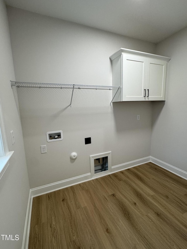 504 Tucker St, Four Oaks, NC 27524 - clothes washing area with hookup for a washing machine, cabinet space, dark wood-style floors, and hookup for a gas dryer