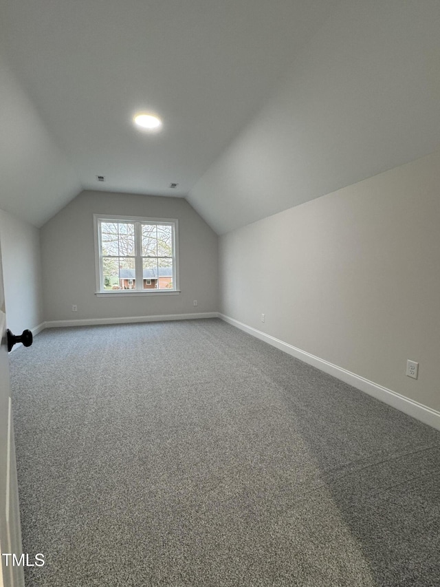 504 Tucker St, Four Oaks, NC 27524 - bonus room featuring carpet, baseboards, vaulted ceiling, and visible vents
