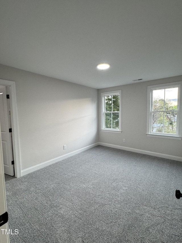 504 Tucker St, Four Oaks, NC 27524 - carpeted empty room with baseboards and visible vents