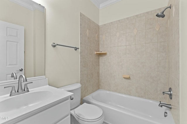 full bathroom featuring ornamental molding, toilet, vanity, and tiled shower / bath