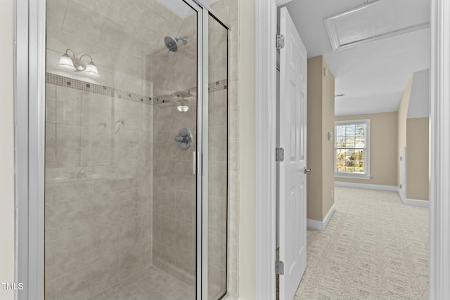 bathroom with a shower with door