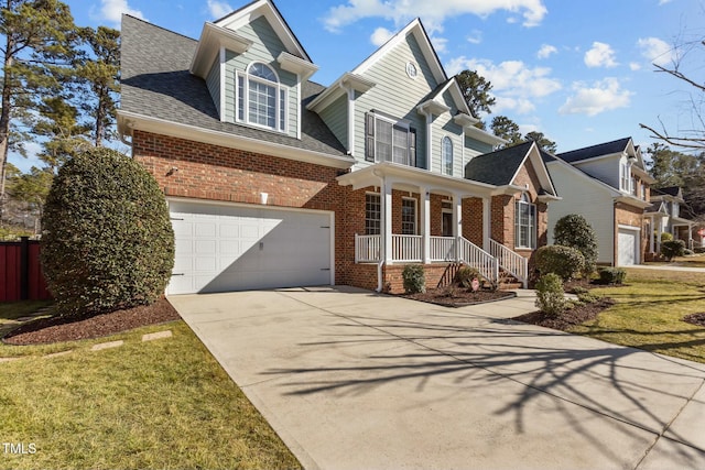 view of front facade with a garage and a front yard