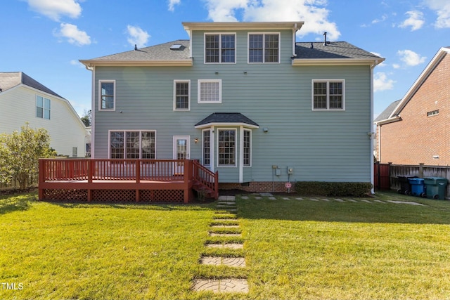 back of property featuring a yard and a deck