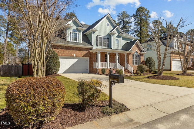 view of front of house with a garage and a porch