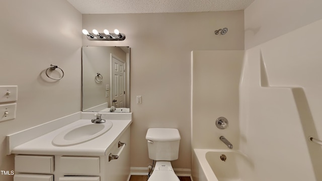 full bathroom featuring a textured ceiling, toilet, vanity, and bathtub / shower combination