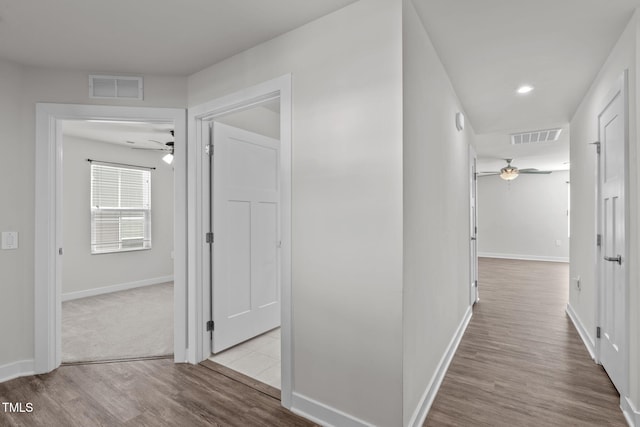 corridor featuring light hardwood / wood-style floors