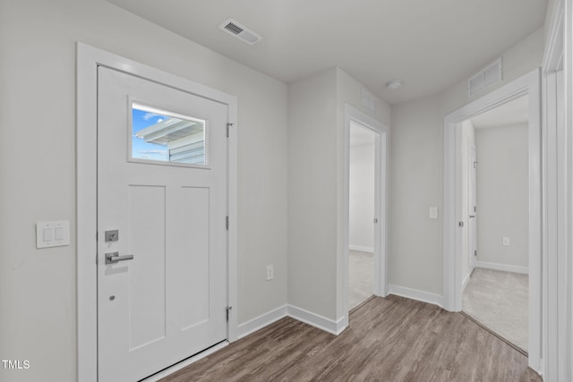 foyer with light wood-type flooring