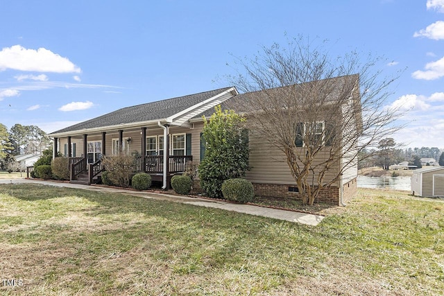 view of front of house with covered porch and a front yard