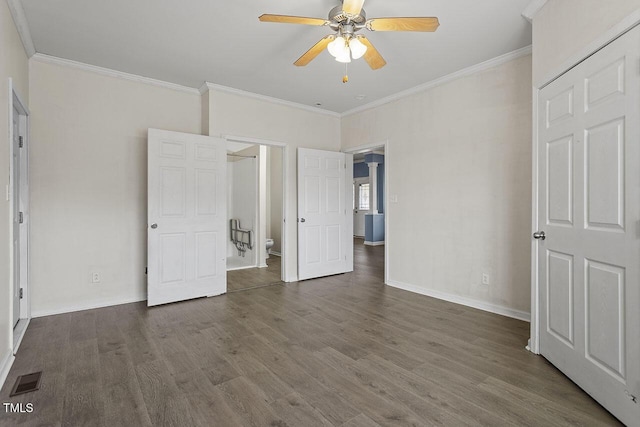 unfurnished bedroom featuring ceiling fan, dark hardwood / wood-style flooring, and crown molding