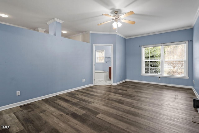 spare room featuring ceiling fan, dark hardwood / wood-style flooring, and ornamental molding