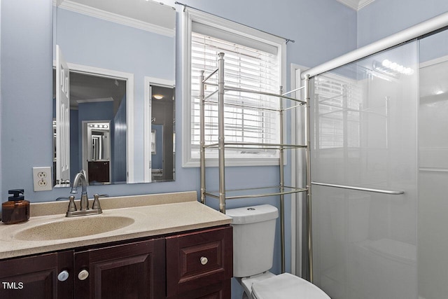 bathroom featuring toilet, vanity, walk in shower, and crown molding