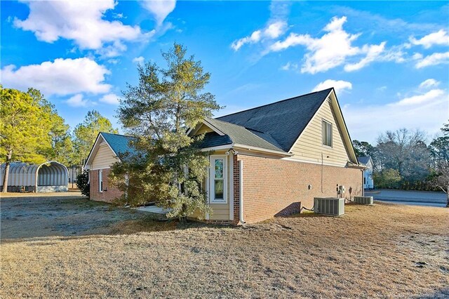 255 Heartwood Dr, Raeford, NC 28376 - view of side of home with central AC unit